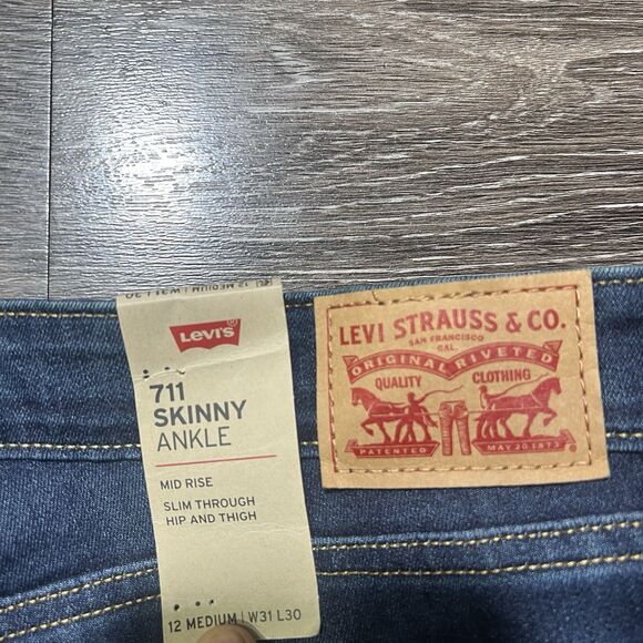 Levi's 711 Skinny Ankle Mid Rise Jeans Womens Size 12 Blue Denim Flare Hem - Picture 5 of 8